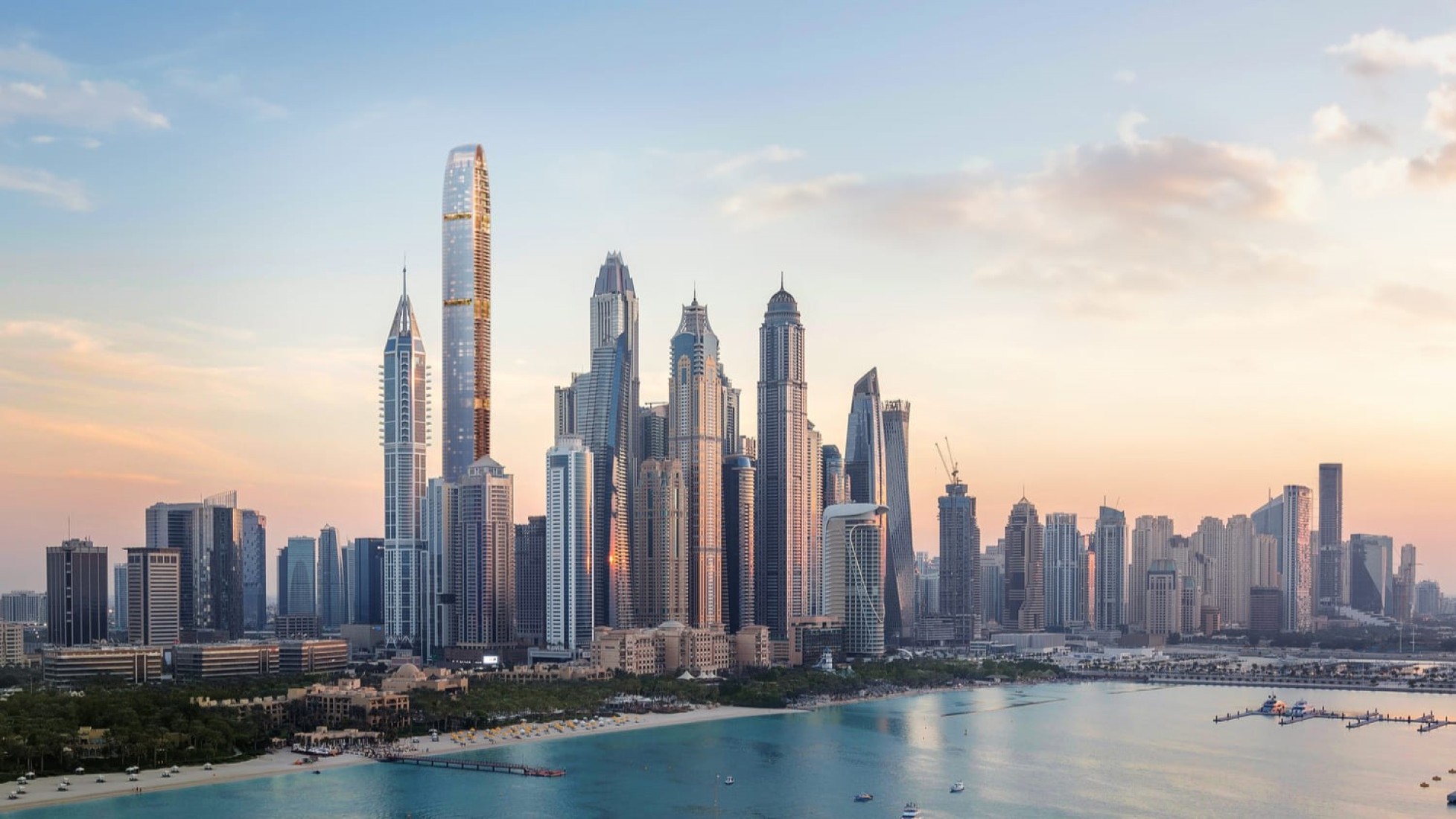 The Dubai Marina skyline above Jumeirah Beach at dusk